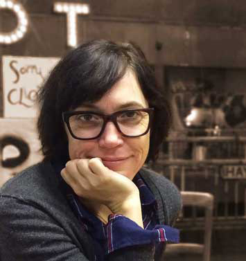 Gillian Best sitting in a café